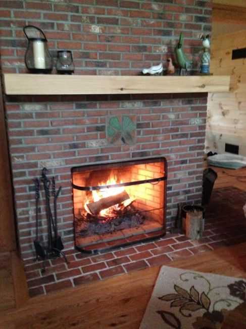 Brick tile fireplace with shamrocks